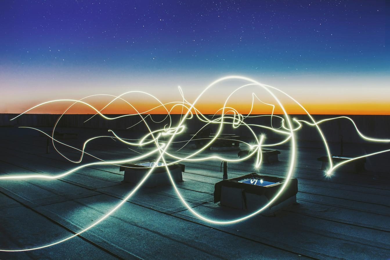 Light trails over an energy landscape at dusk