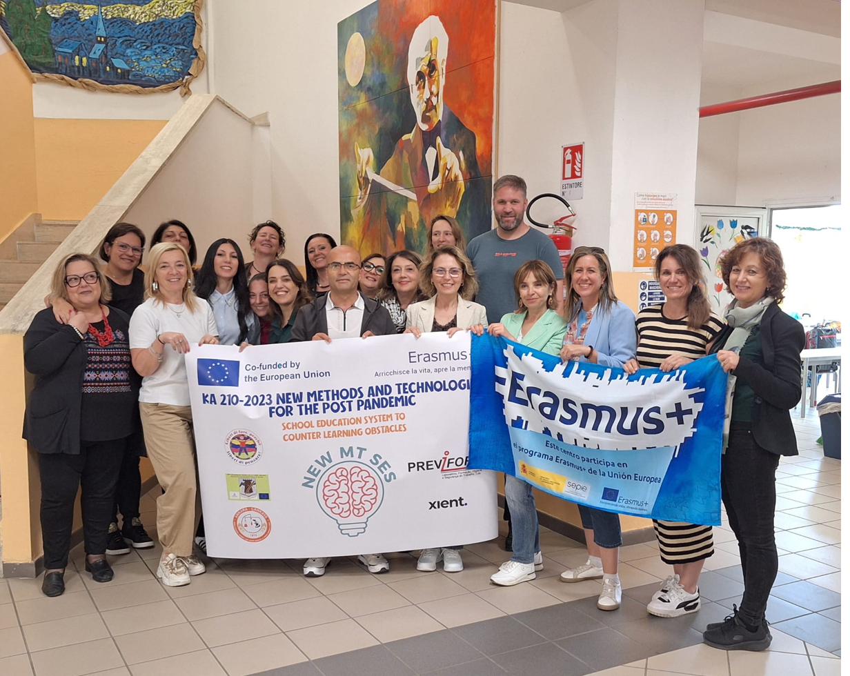 The international New MTSES team in Aprilia, Italy, with the project banner and an Erasmus+ flag